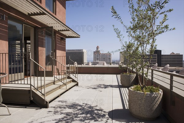 Outdoor patio with view of city.