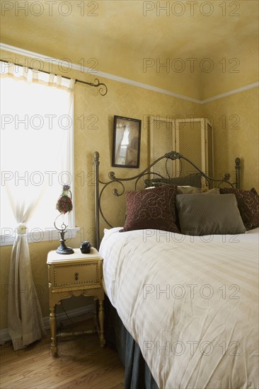 Vignette of naturally lit bedroom.