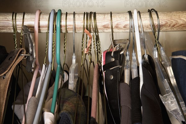 Detail of hangers with men's clothing.