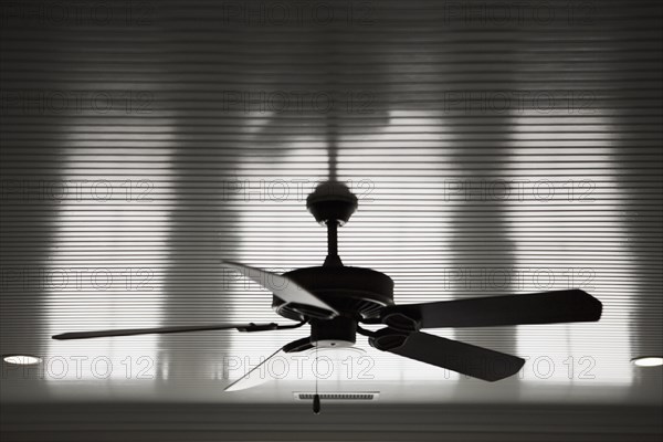 Black and white detail of ceiling fan.