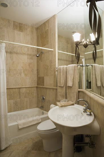 Detail of neutral colored bathroom.