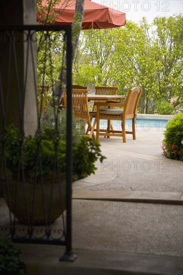 View down path to sitting area beside pool.