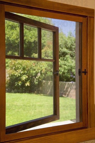 View to a yard from a small open window