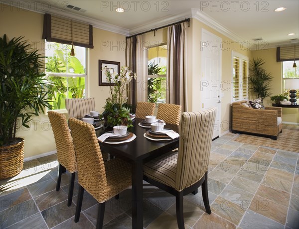 Dining room with tile floor and recessed lighting