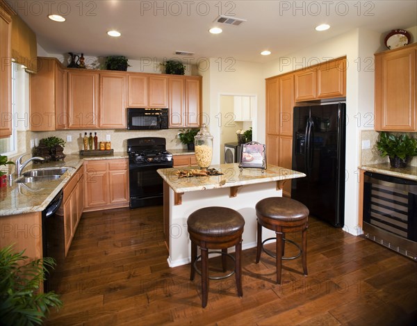 Kitchen island with breakfast bar in kitchen