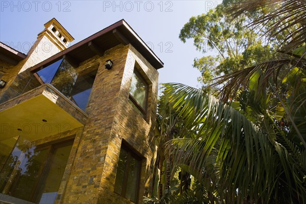 Rear exterior of a large tuscan style home