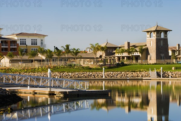 View of contemporary housing community from across channel