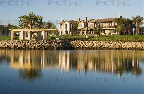 View of contemporary housing community from across channel