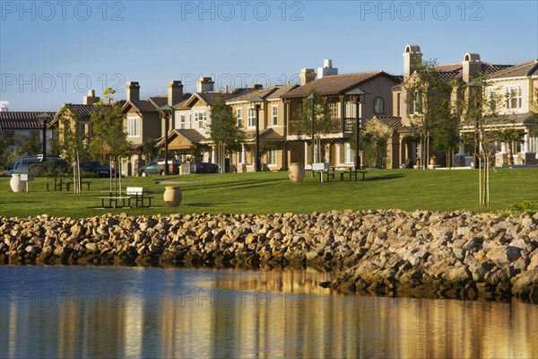 View of contemporary housing community from across channel