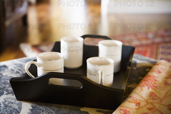 Tray holding four coffee cups