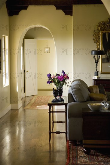 Hallway leading past a large living room