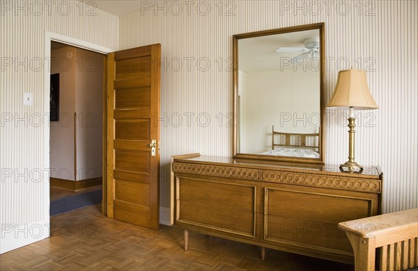 Room with an open door and a credenza