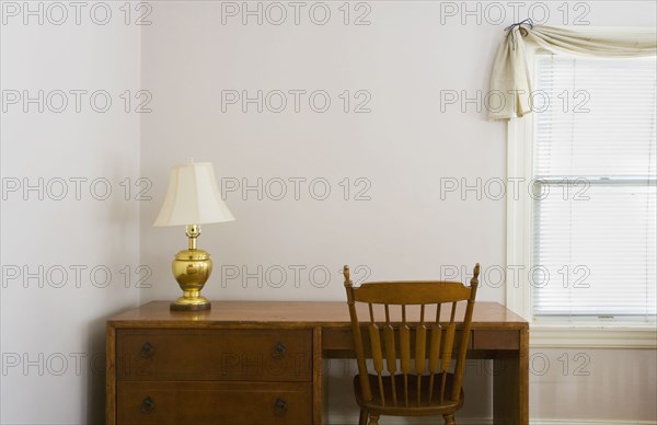 Small desk next to a window