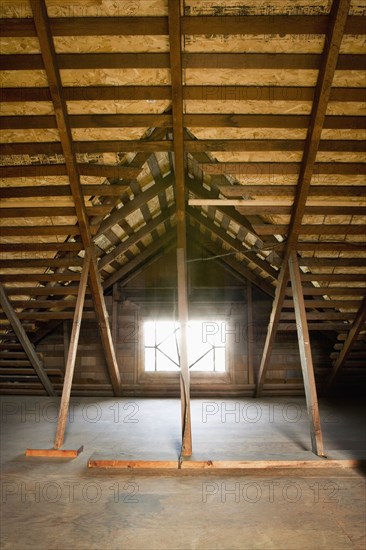 Small window in an unfinished attic