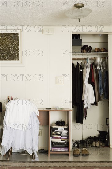 A desk and closet of a young college student