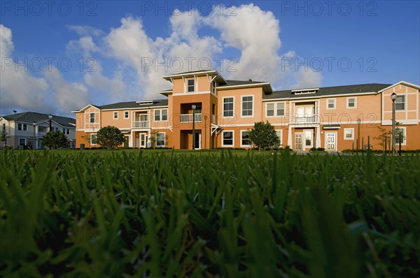 View of apartment complex from grass