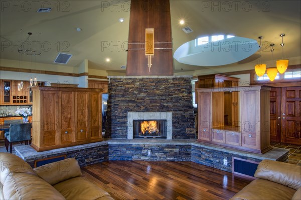 Traditional living room with stone fireplace