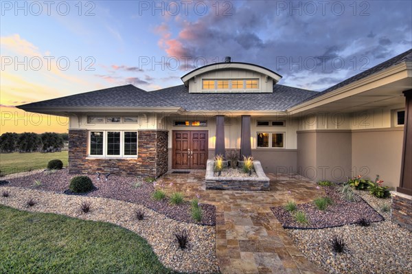Front elevation custom home with landscaping
