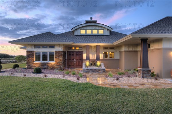 Front elevation custom home with landscaping