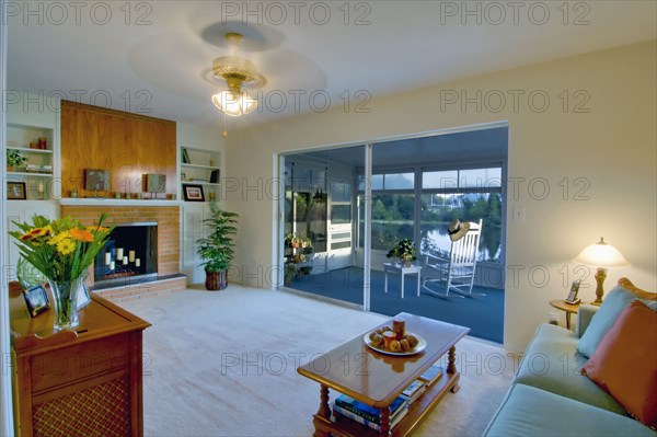 Living room and sunroom in traditional home