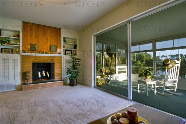 Living room and sunroom in traditional home