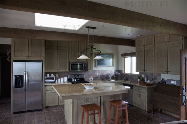 Western style kitchen with breakfast bar and island