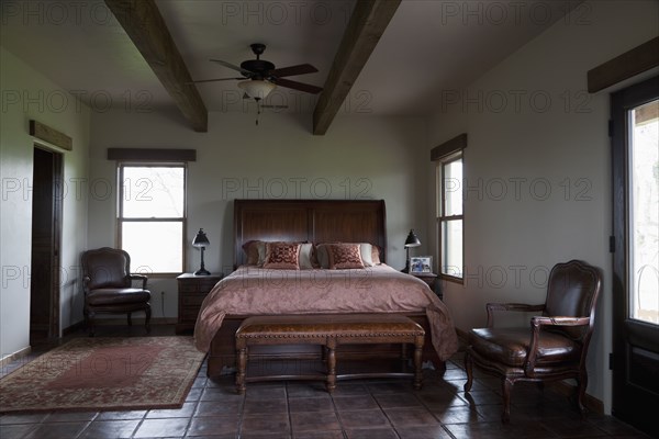 Leather bench at foot of master bed