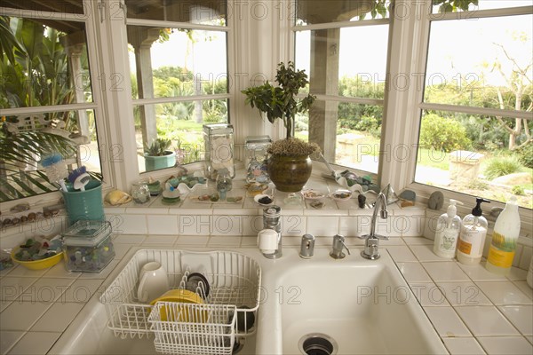 Kitchen sink in corner with windows