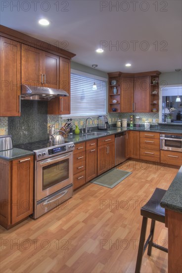 Kitchen counter with hardwood floor in contemporary house