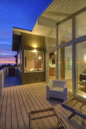 Seating area in balcony with floorboards