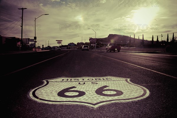 Historic Route 66 sign in pavement on road