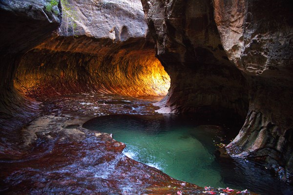 Rock formations and pool in cave