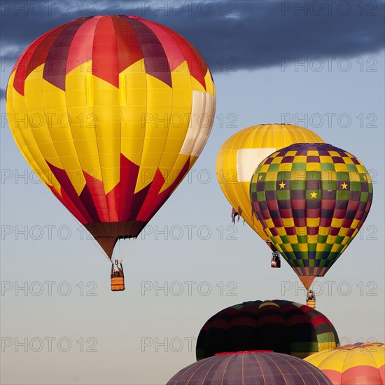 Hot air balloons floating in blue sky