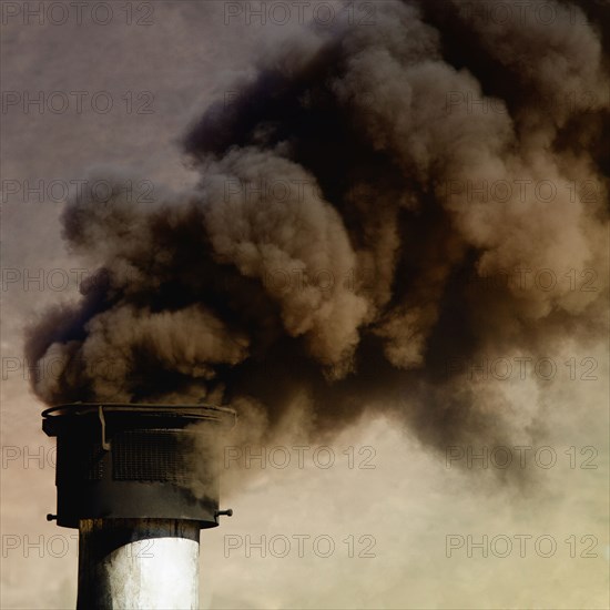 Close up of smoke billowing from smoke stack