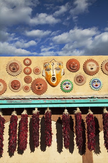 Ornamental masks and hanging dried peppers