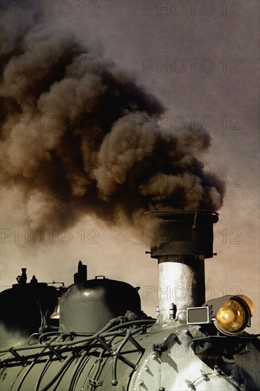 Close up of billowing smoke stack on train