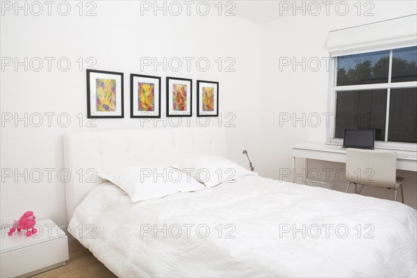 Bed and wall art in modern bedroom