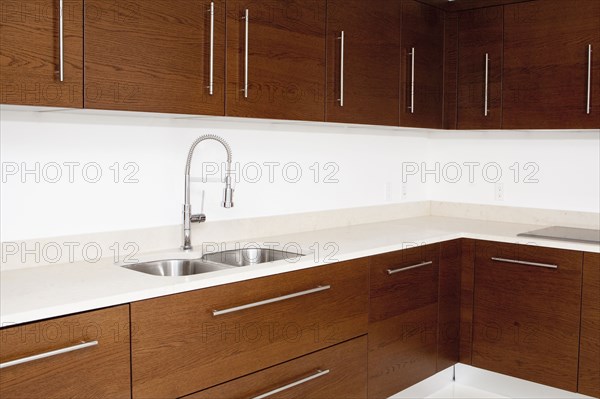 Sink and cabinets in modern kitchen