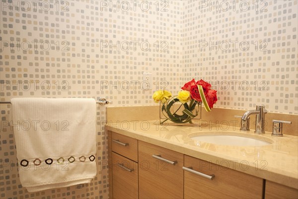 Sink and towel in modern bathroom