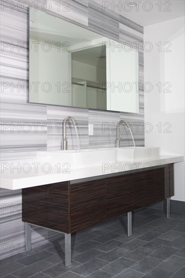 Sinks and mirror in modern bathroom