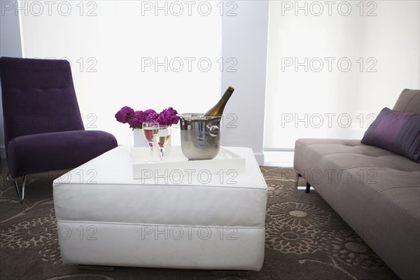 Champagne on coffee table in modern living room