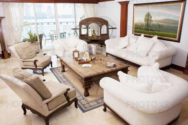 High angle view of sofas and armchairs in ornate living room