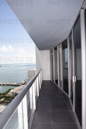 Balcony of modern apartment overlooking waterfront