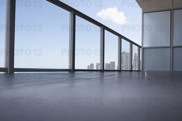 Low angle view of apartment balcony overlooking cityscape