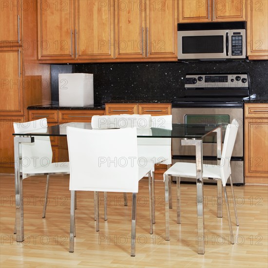 Table and chairs in modern kitchen