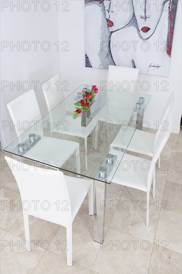 High angle view of table and chairs in modern dining room