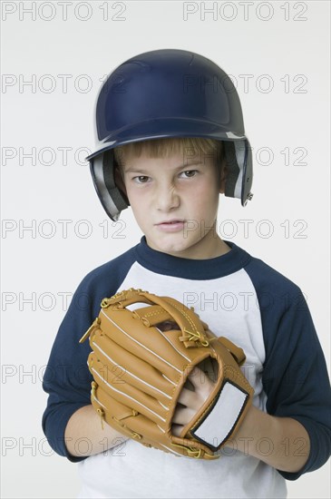 Boy wearing baseball outfit