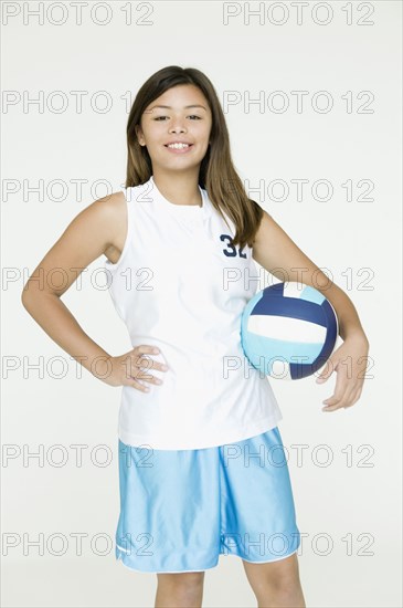 Asian girl holding volley ball