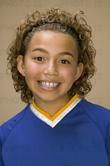 Close up of African American girl smiling