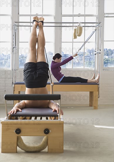 People stretching in exercise studio